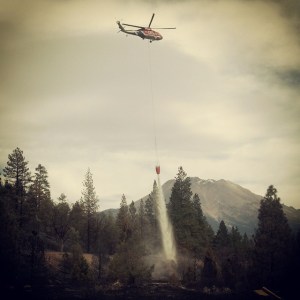 Helicopter makes a water drop on the Boles Fire in Weed, CA