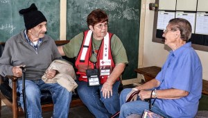 Volunteer Pat Day speaks with Weed residents at the Boles Fire evacuation shelter in Mt Shasta. Pat served as the shelter manager.