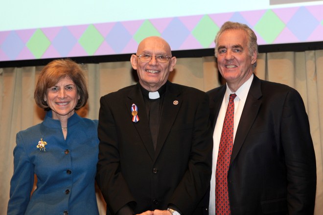 George Schubel receives the Preparedness, Health and Safety Services Award from Red Cross CEO Gail McGovern and President of Preparedness, Health and Safety Services, Jack McMaster. Photo by Jason Colston/American Red Cross