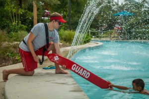 Used for the 2014 Aquatic Attraction Lifeguarding course presentation and other materials related to this course.  Pictures depict lifeguards in a waterpark setting demonstrating the skills needed for lifeguards to get certified to work in this environment. Photo by Michael Del Polito/American Red Cross © Stock photo taken for the American Red Cross