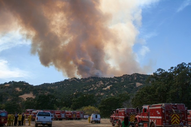 A large flare-up from the Wragg Fire is seen in a photograph taken in rural Solano County, California on July 28, 2015. (Photo credit: Matthew Keys)